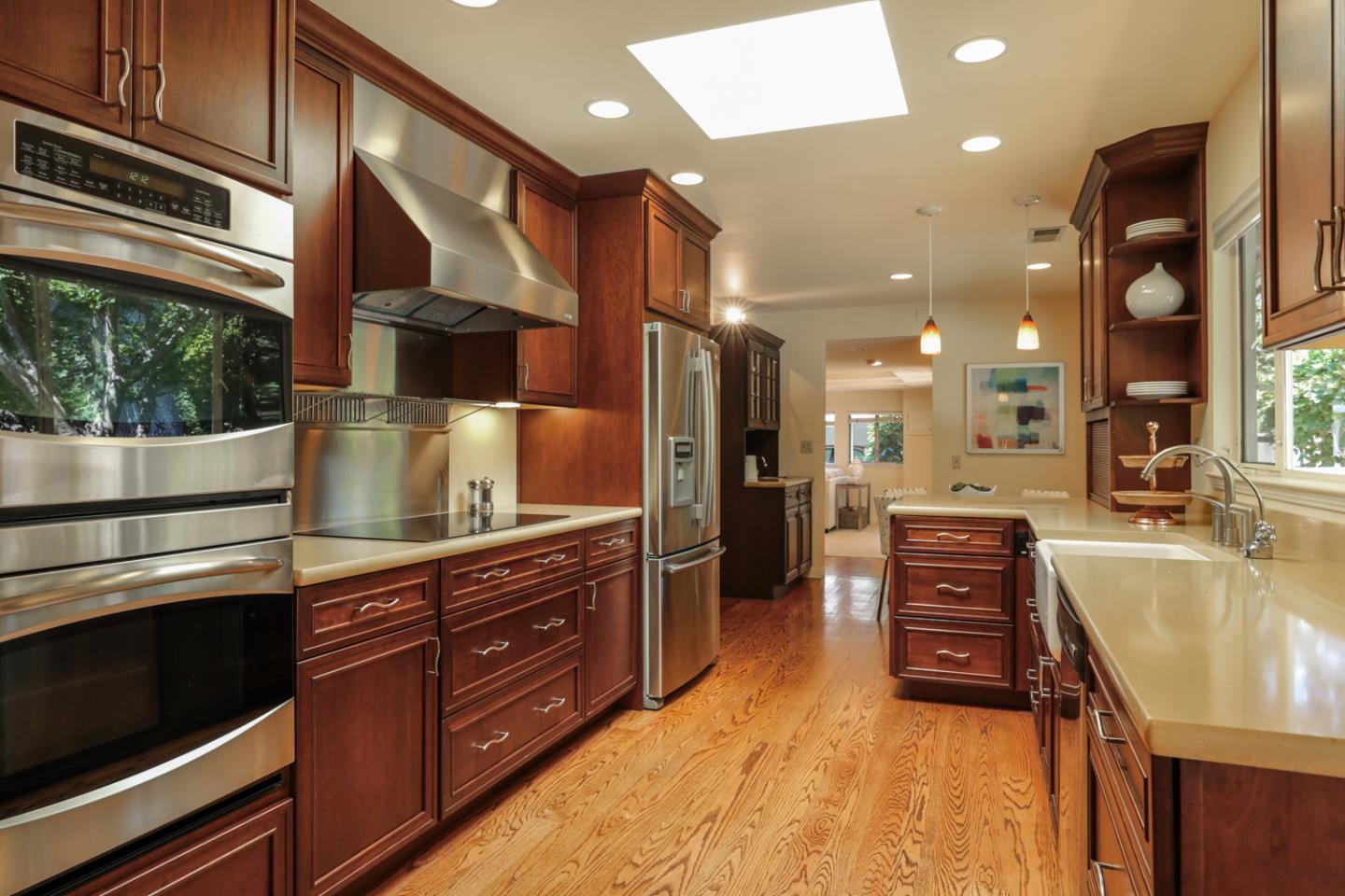 3 Irving Avenue Atherton, CA 94027 - Photo 6 of 22 a kitchen with stainless steel appliances granite countertop a sink and cabinets