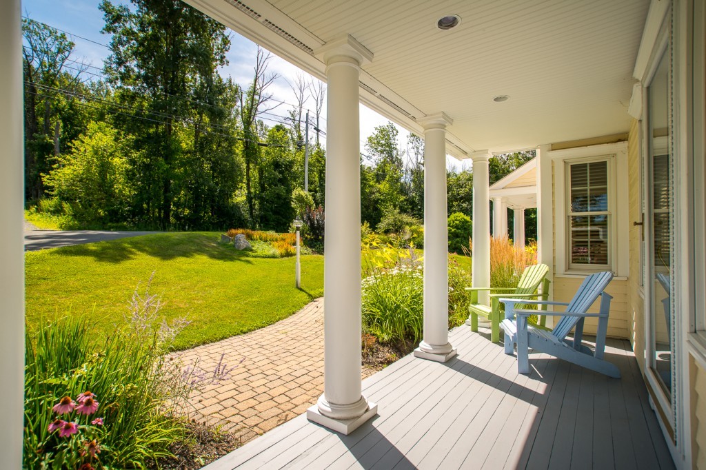 180 Westboro Road Upton, MA 01568 - Photo 30 of 30 a view of balcony with two chairs and floor to ceiling window yard