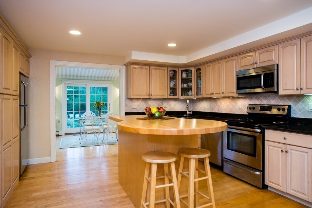 180 Westboro Road Upton, MA 01568 - Photo 3 of 30 a kitchen with stainless steel appliances granite countertop a stove a sink and a microwave