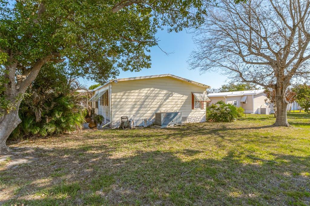 917 Cypress Street Sebastian, FL 32976 - Photo 12 of 80 a view of a house with a yard and tree s