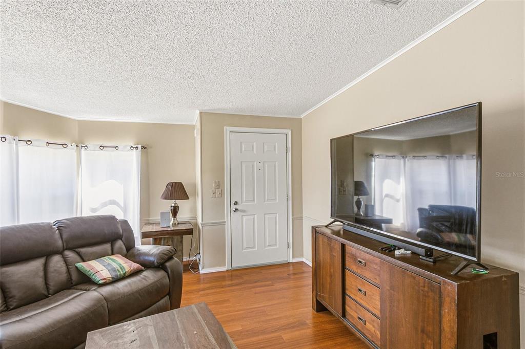 917 Cypress Street Sebastian, FL 32976 - Photo 14 of 80 a living room with furniture and a wooden floor