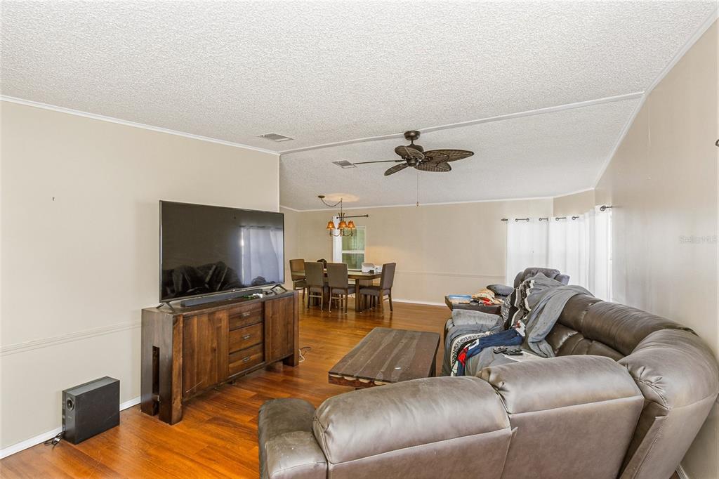 917 Cypress Street Sebastian, FL 32976 - Photo 15 of 80 a living room with furniture and a flat screen tv