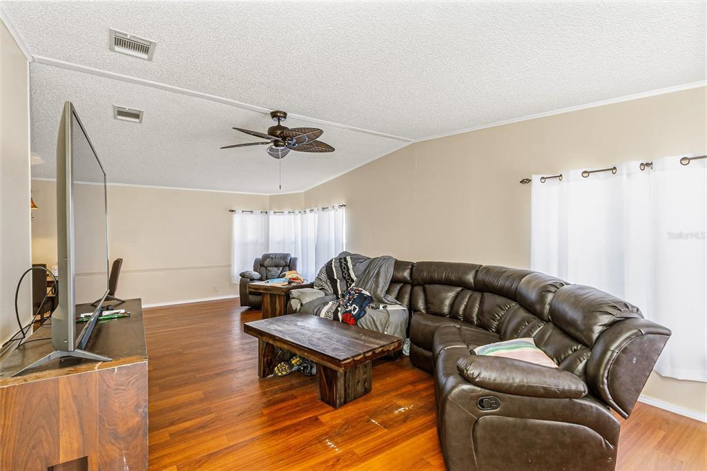 917 Cypress Street Sebastian, FL 32976 - Photo 16 of 80 a living room with furniture and a wooden floor