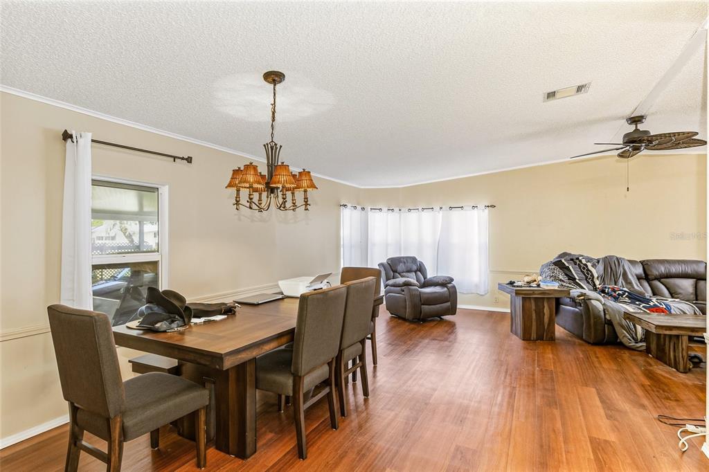 917 Cypress Street Sebastian, FL 32976 - Photo 17 of 80 a view of a dining room with furniture window and wooden floor