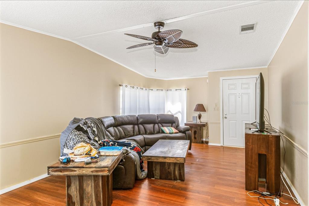 917 Cypress Street Sebastian, FL 32976 - Photo 18 of 80 a living room with furniture and a wooden floor