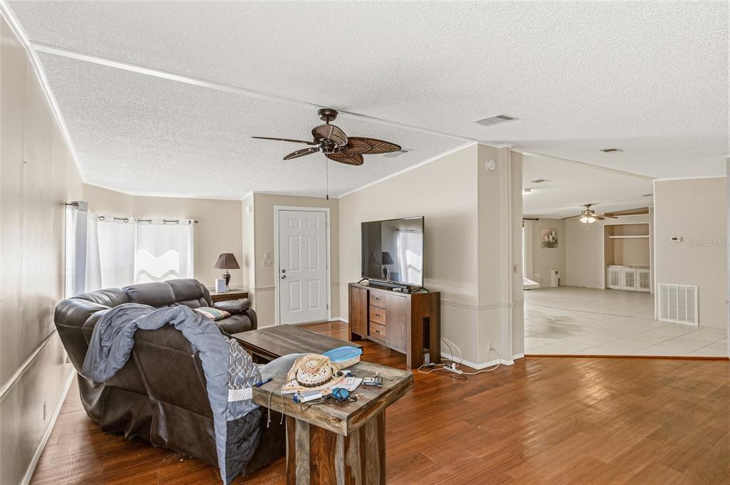 917 Cypress Street Sebastian, FL 32976 - Photo 19 of 80 a living room with furniture and a wooden floor