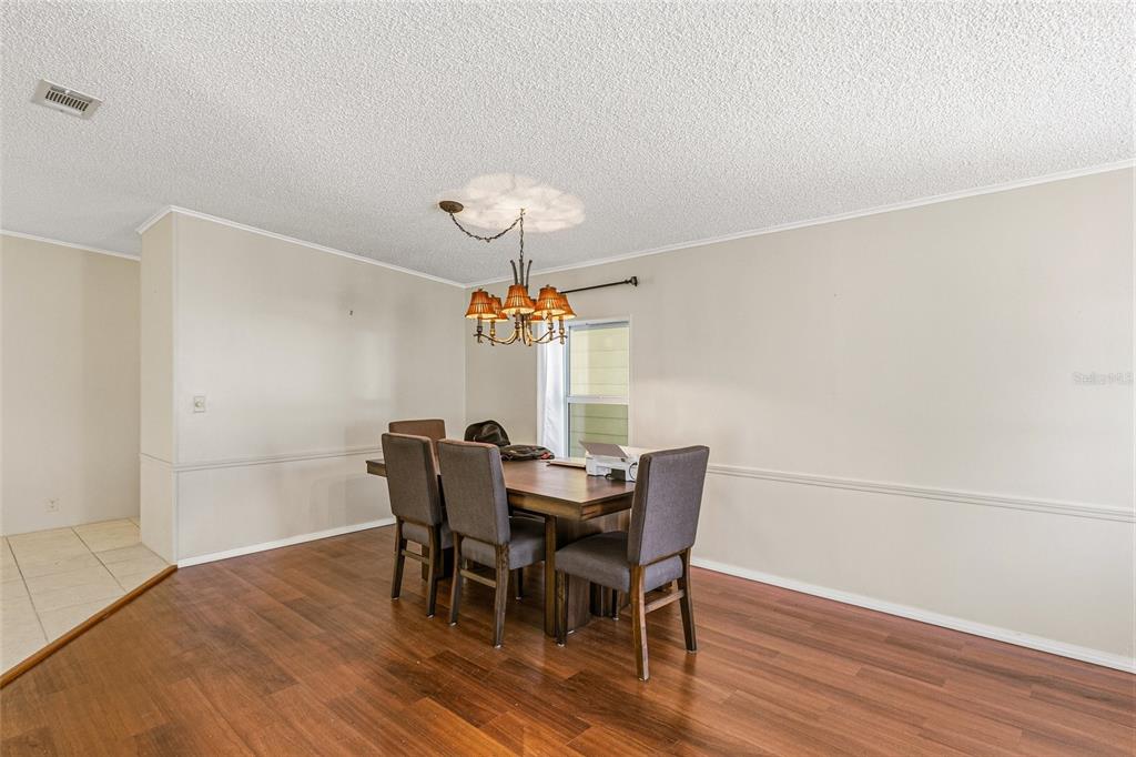 917 Cypress Street Sebastian, FL 32976 - Photo 20 of 80 a view of a dining room with furniture window and wooden floor