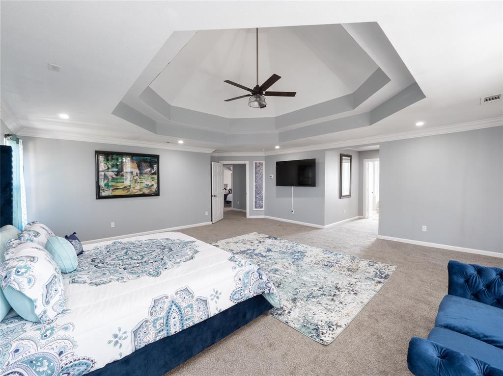 7321 North State Highway Blue Ridge, TX 75424 - Photo 12 of 30 Huge Master bedroom featuring a raised ceiling, a ceiling fan, recessed lighting, and ornamental molding
