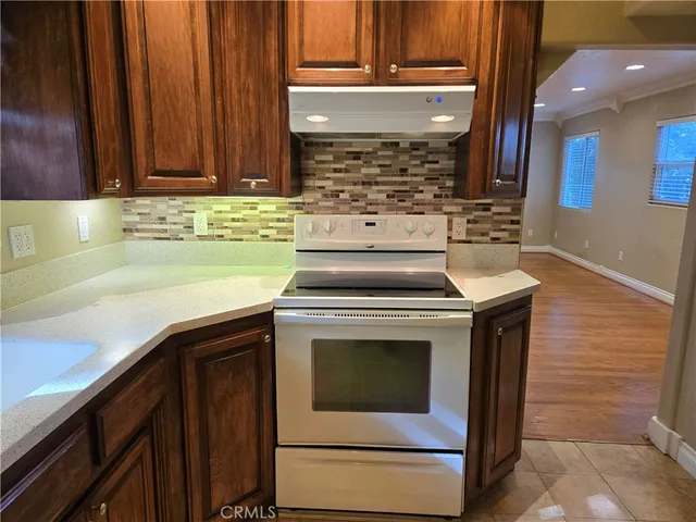 a white refrigerator freezer sitting next to a window