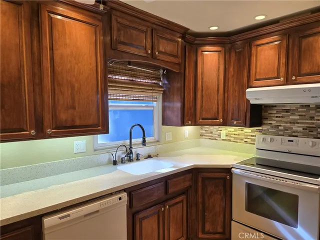a view of a hallway with washer and dryer