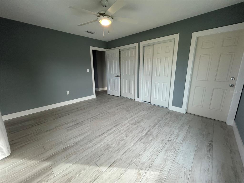 3112 Magnolia Way Punta Gorda, FL 33950 - Photo 18 of 20 a view of an empty room with wooden floor