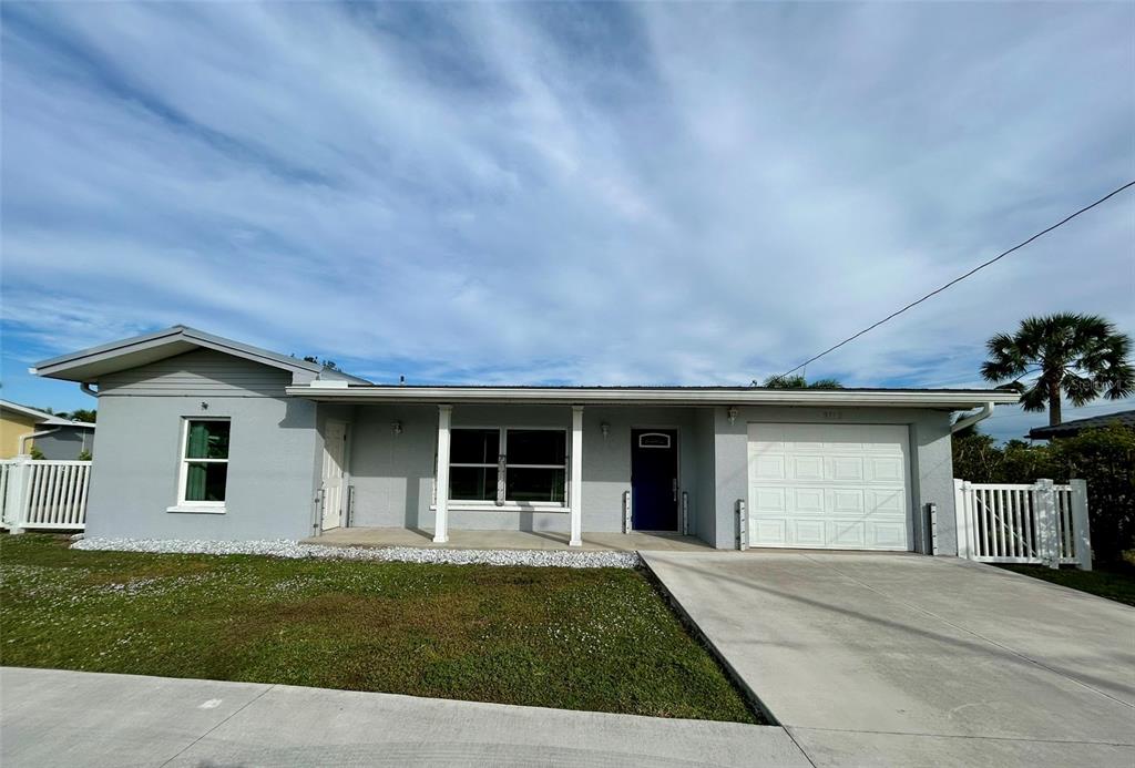 3112 Magnolia Way Punta Gorda, FL 33950 - Photo 2 of 20 a front view of a house with a garden