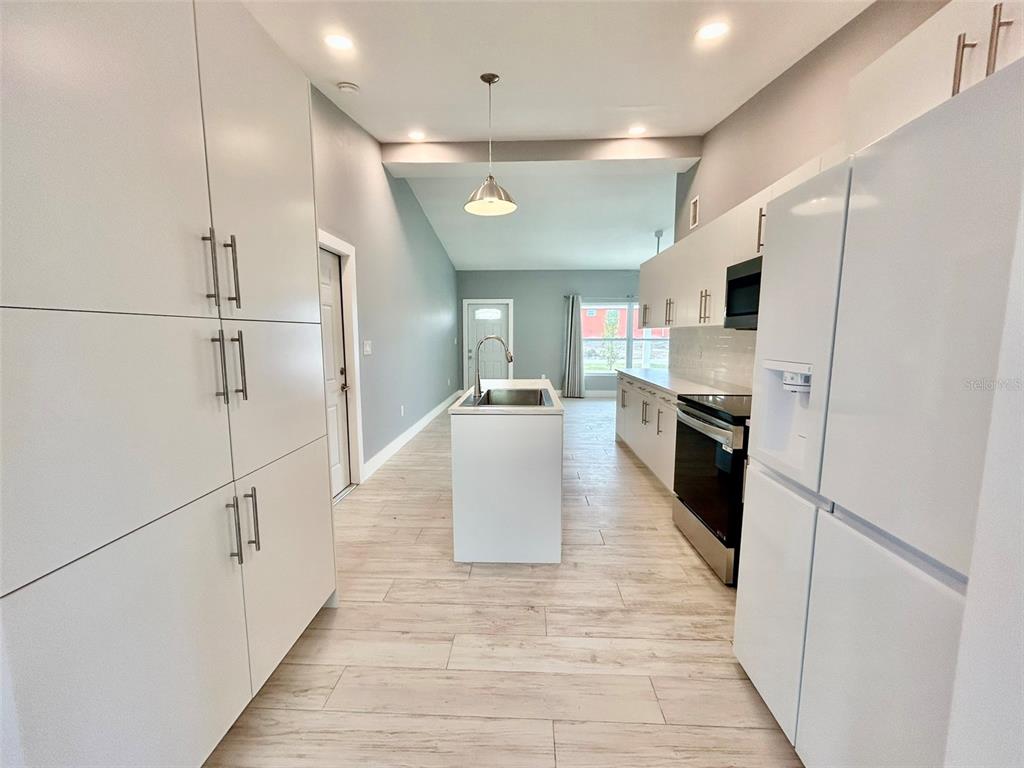 3112 Magnolia Way Punta Gorda, FL 33950 - Photo 5 of 20 a kitchen with stainless steel appliances granite countertop a refrigerator a sink and a stove