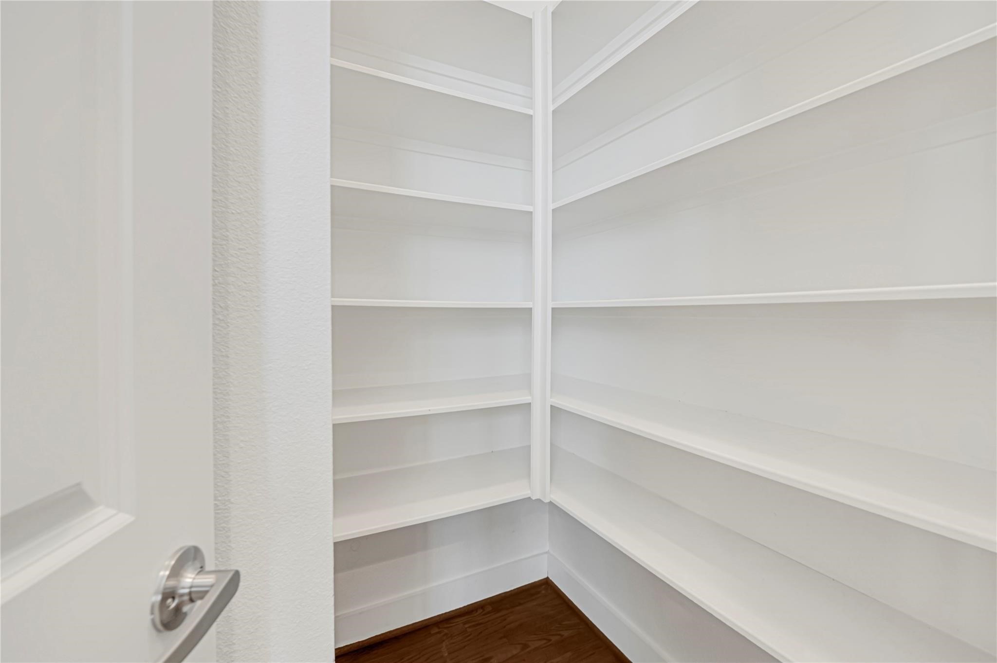 1210 Cedarpost Tree Springs Place, Unit P Houston, TX 77055 - Photo 11 of 25 a view of walk in closet with empty racks