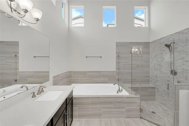 a bathroom with a bathtub and a sink