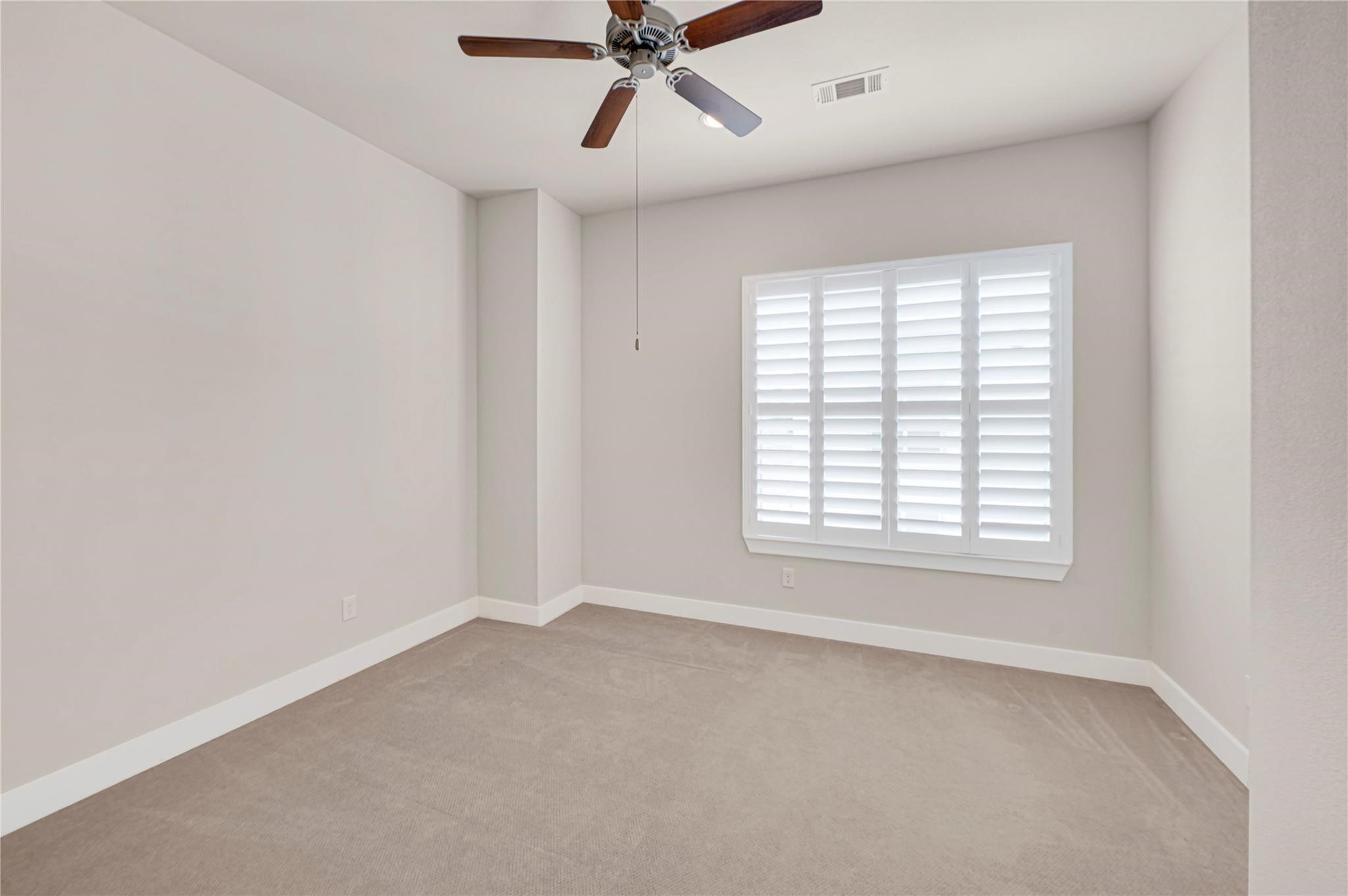 1210 Cedarpost Tree Springs Place, Unit P Houston, TX 77055 - Photo 18 of 25 a view of an empty room with a window