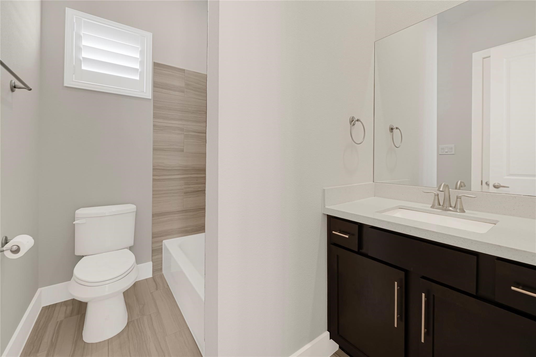 1210 Cedarpost Tree Springs Place, Unit P Houston, TX 77055 - Photo 22 of 25 a bathroom with a toilet sink and mirror