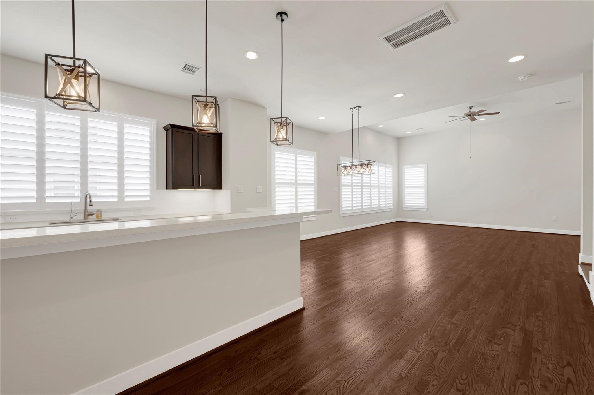 1210 Cedarpost Tree Springs Place, Unit P Houston, TX 77055 - Photo 6 of 25 a view of a kitchen with a sink and wooden floor