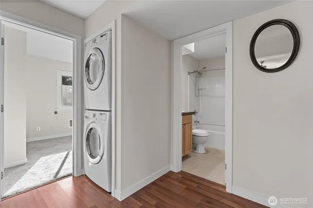 a view of a bathroom with washer and dryer