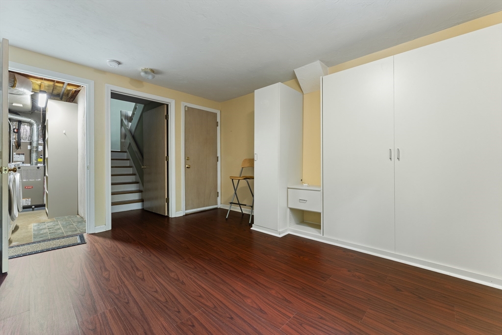 22 Arrowhead Circle, Unit 22 Ashland, MA 01721 - Photo 31 of 35 an empty room with wooden floor and closet