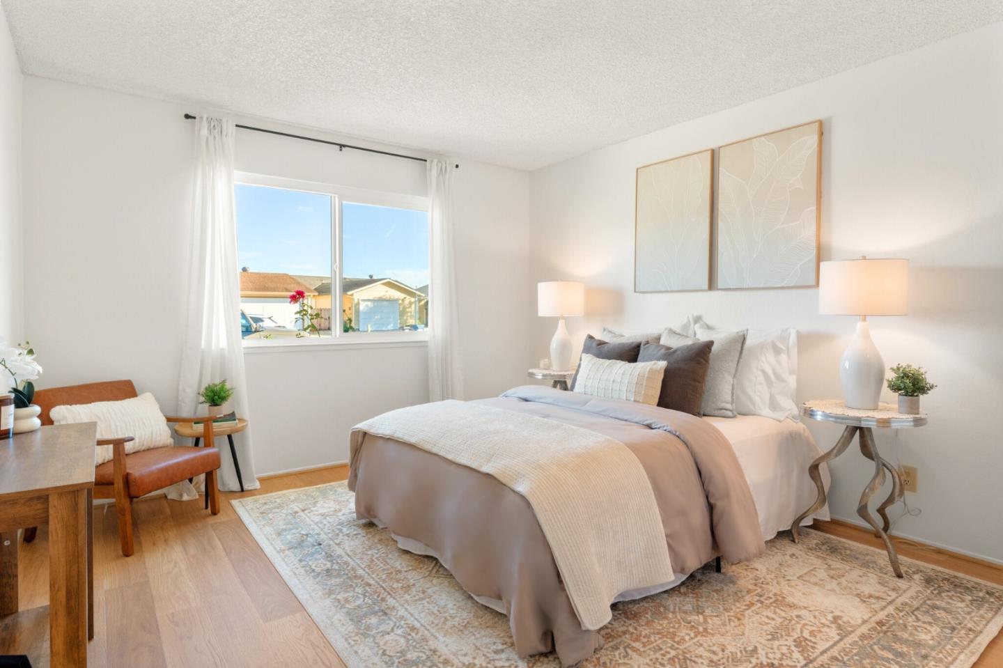 643 Peartree Drive Watsonville, CA 95076 - Photo 12 of 26 a bedroom with a bed and wooden floor