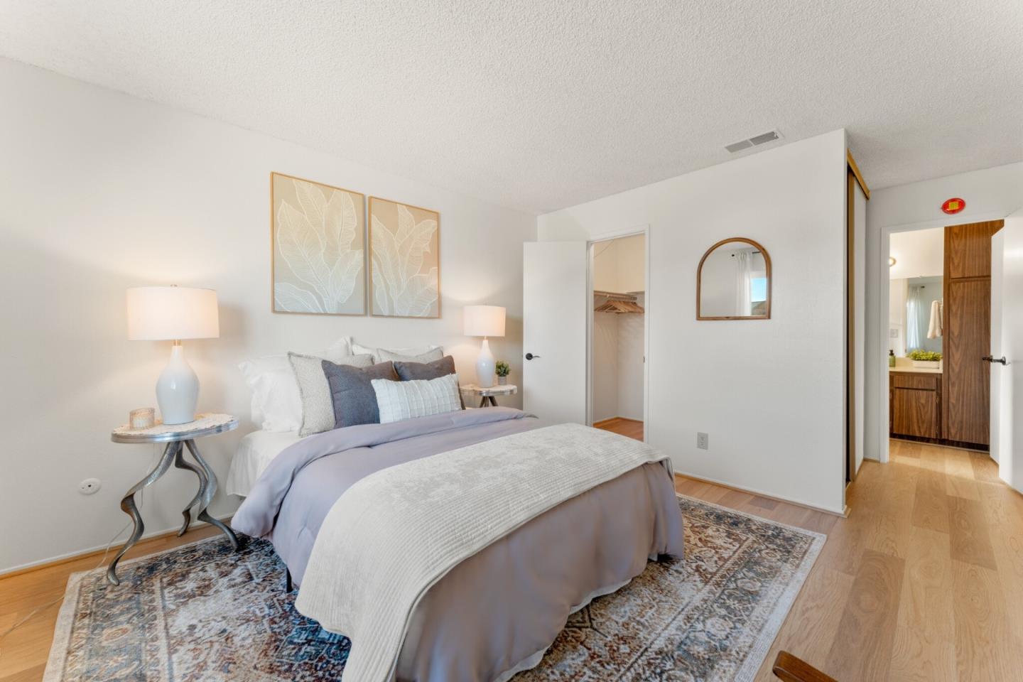 643 Peartree Drive Watsonville, CA 95076 - Photo 13 of 26 a bedroom with a bed and a lamp