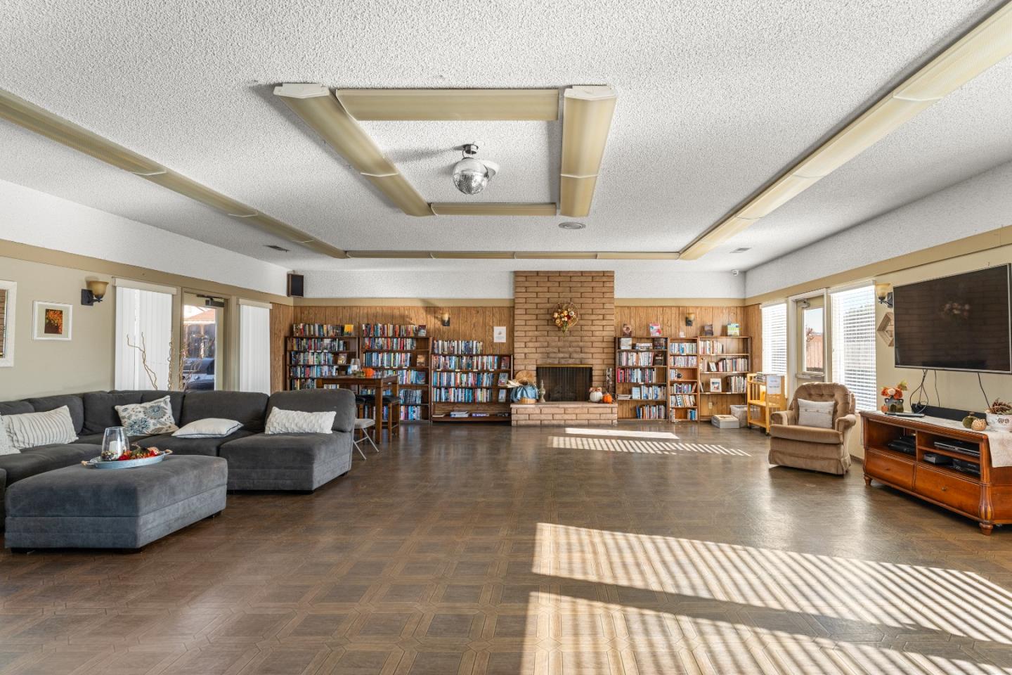643 Peartree Drive Watsonville, CA 95076 - Photo 25 of 26 a living room with furniture and a flat screen tv