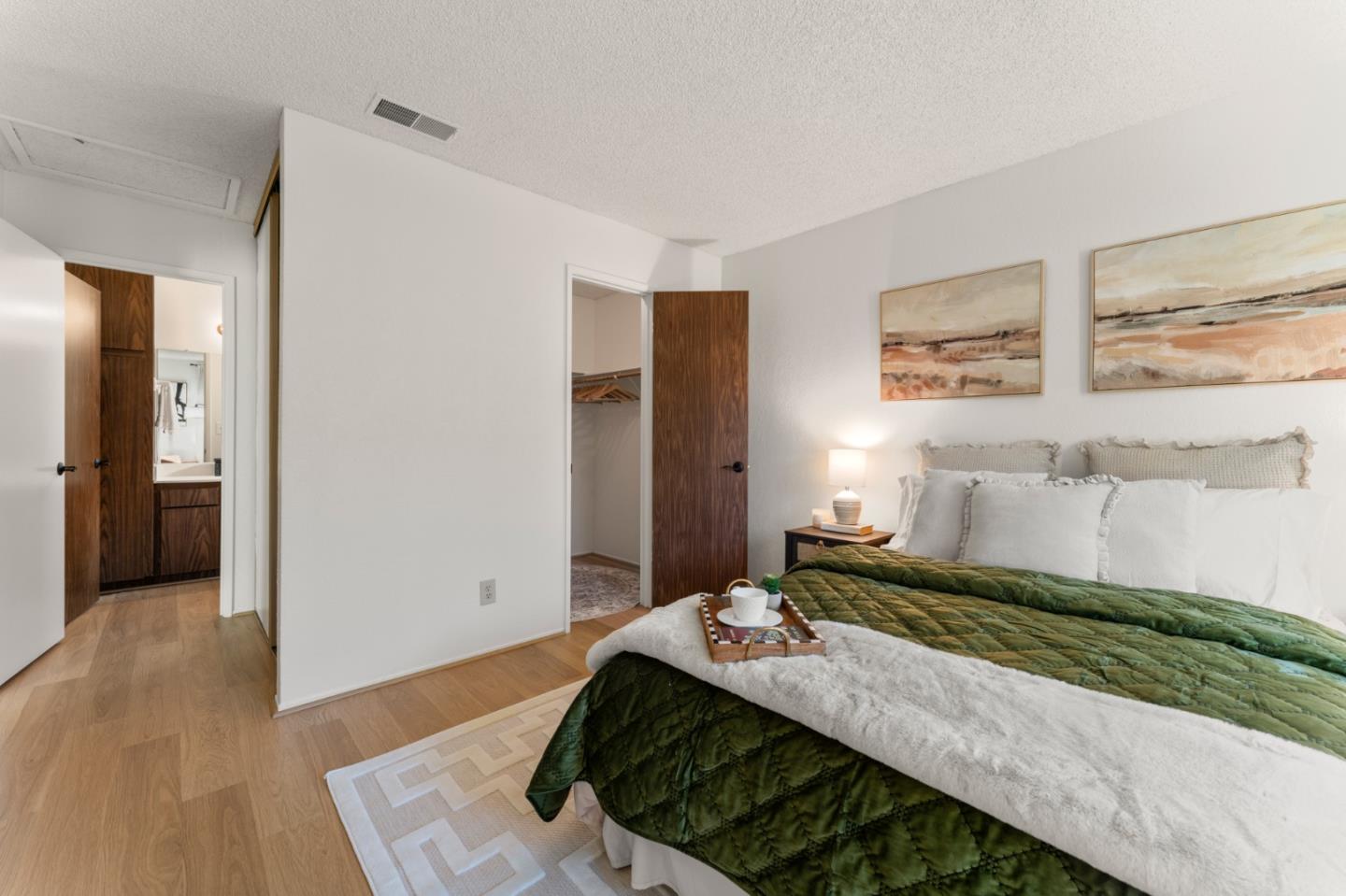 643 Peartree Drive Watsonville, CA 95076 - Photo 10 of 26 a bedroom with a bed and a painting on the wall