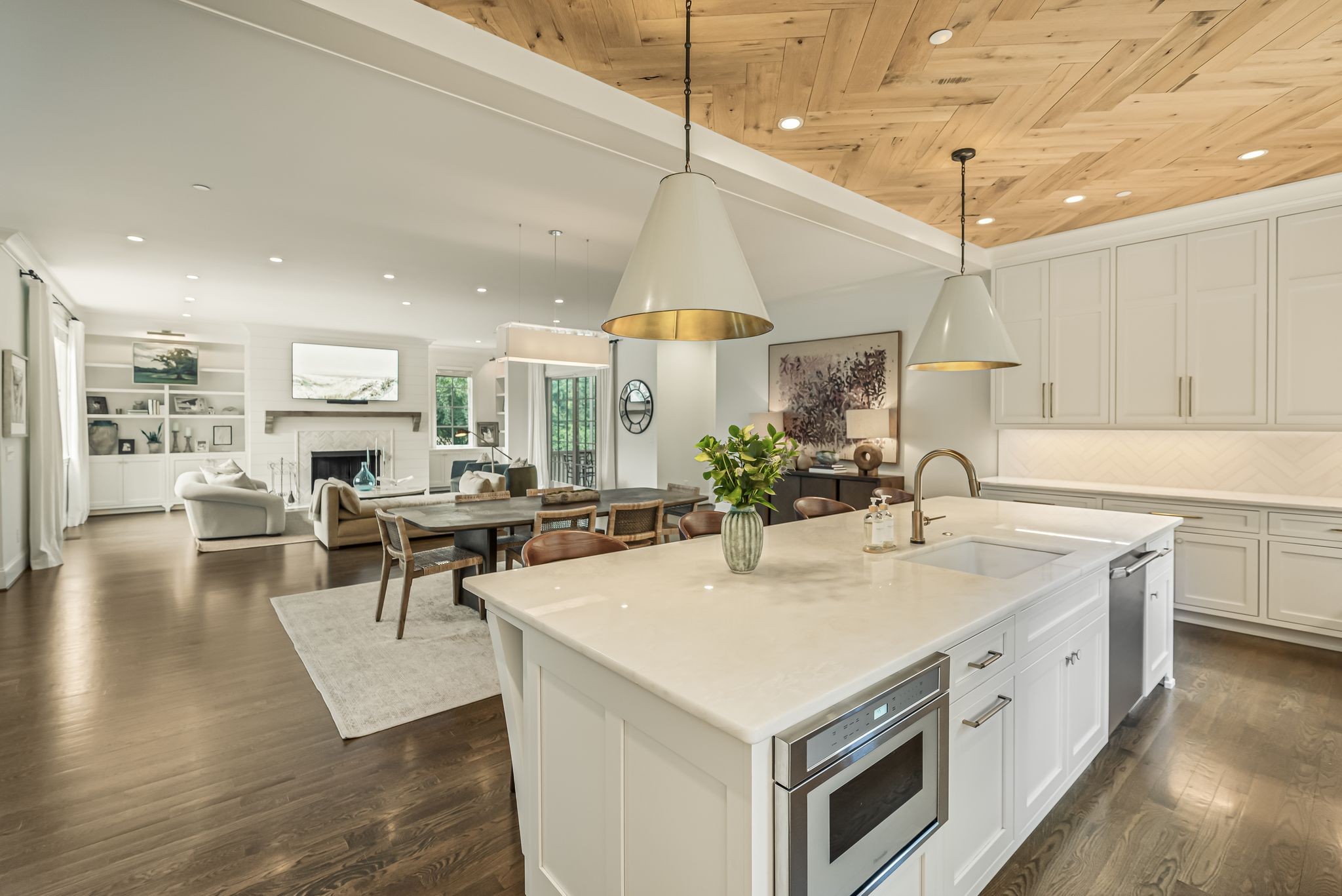 154 A Cheek Road Nashville, TN 37205 - Photo 15 of 61 a large white kitchen with a center island and living room view