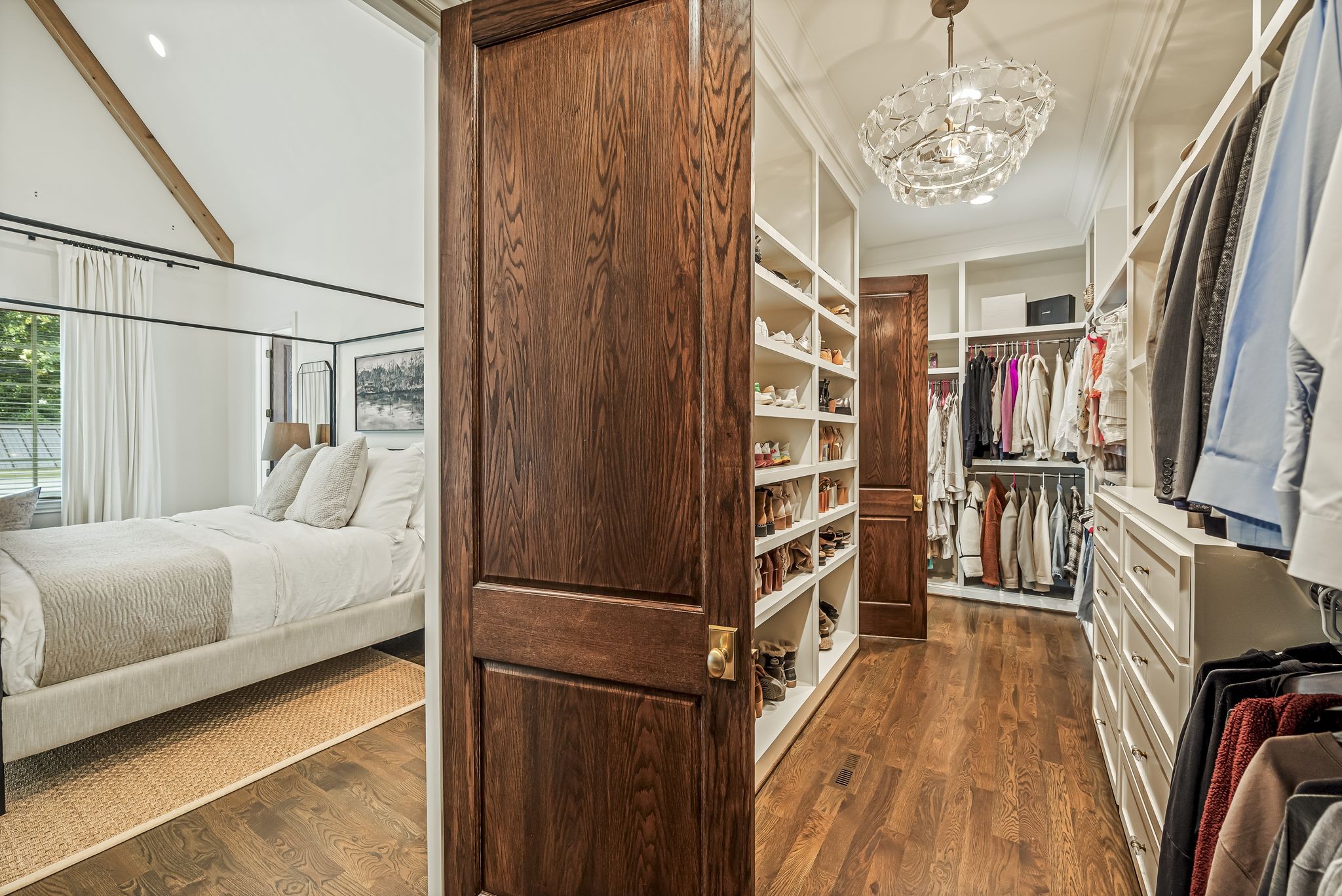 154 A Cheek Road Nashville, TN 37205 - Photo 32 of 61 a bedroom with a bed and a chandelier