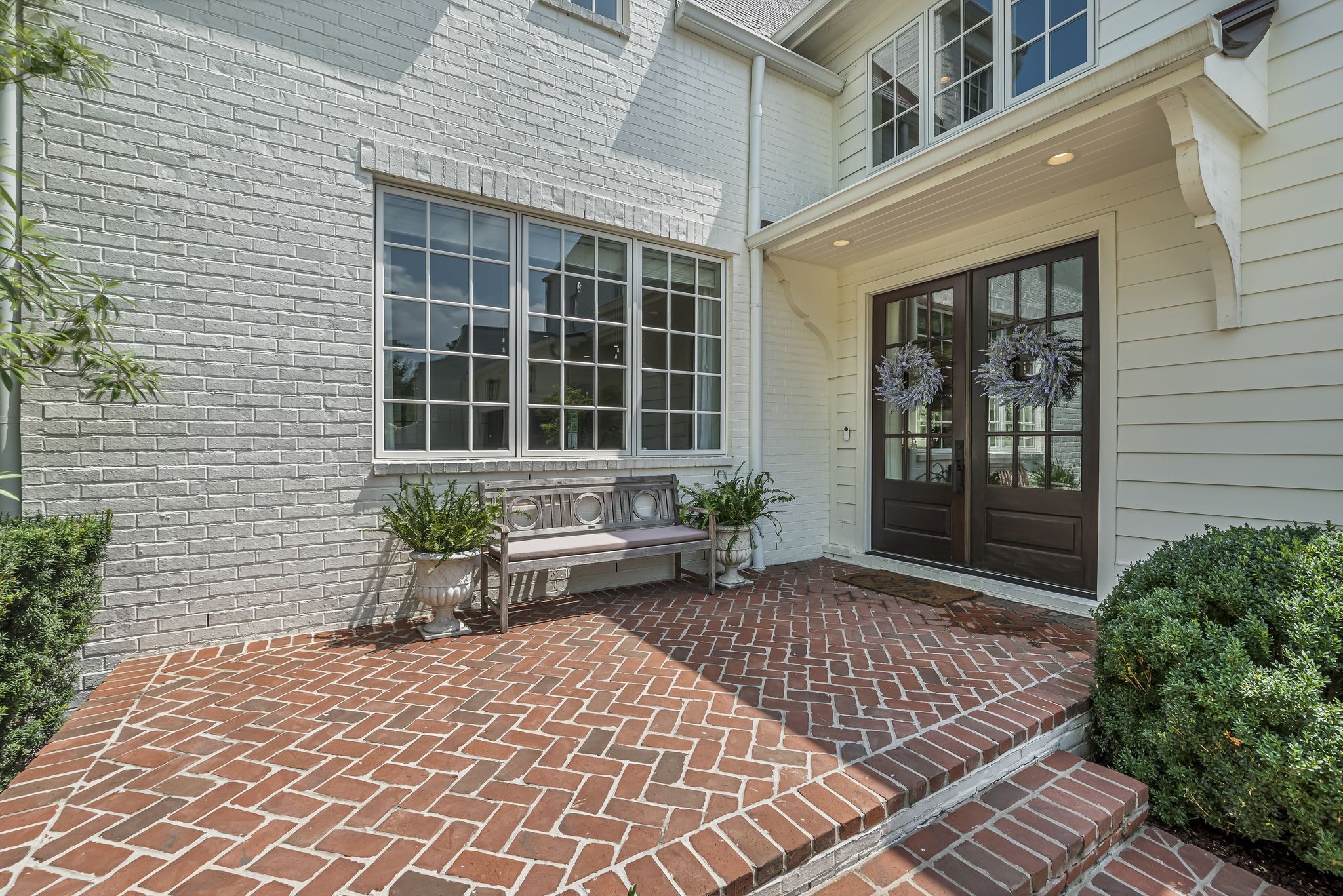 154 A Cheek Road Nashville, TN 37205 - Photo 4 of 61 a front view of a house with a bench