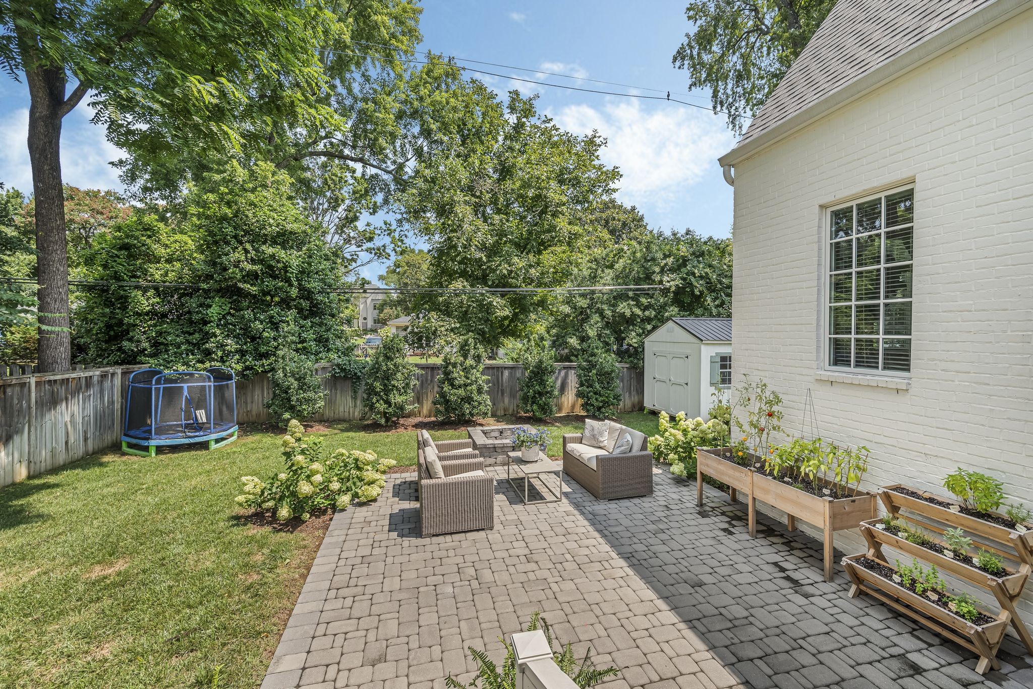 154 A Cheek Road Nashville, TN 37205 - Photo 55 of 61 a view of a backyard with sitting area and furniture