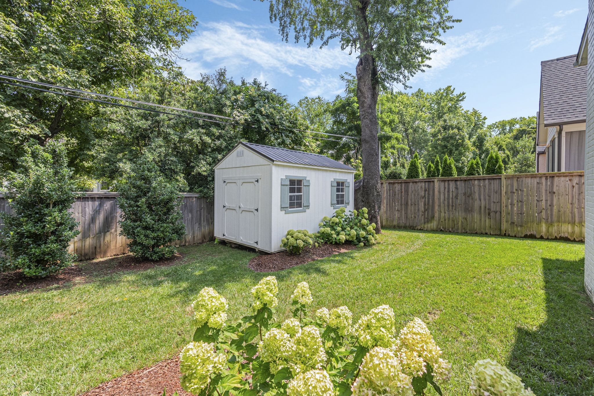 154 A Cheek Road Nashville, TN 37205 - Photo 57 of 61 a view of a house with backyard and garden