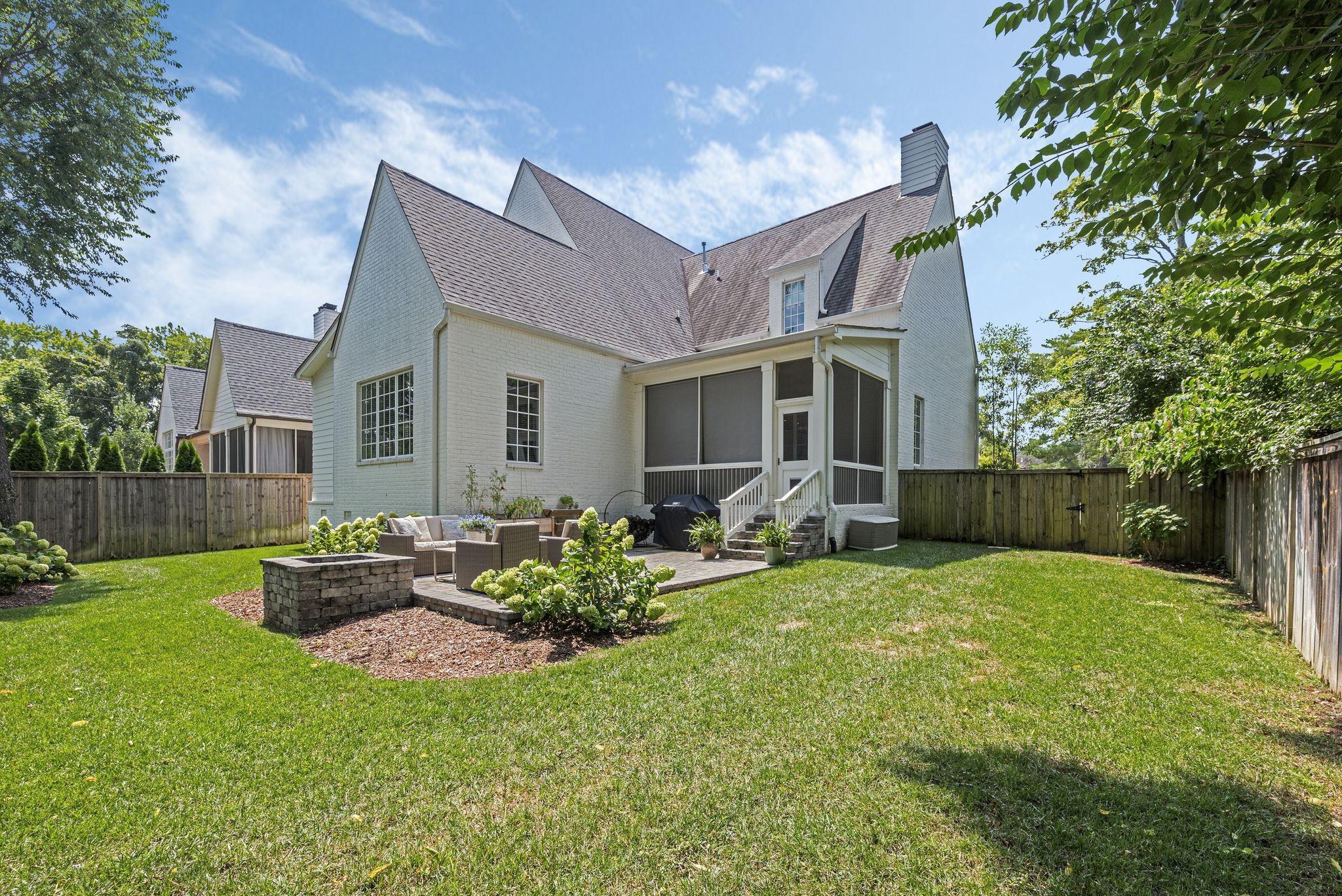 154 A Cheek Road Nashville, TN 37205 - Photo 59 of 61 a front view of a house with a garden and yard