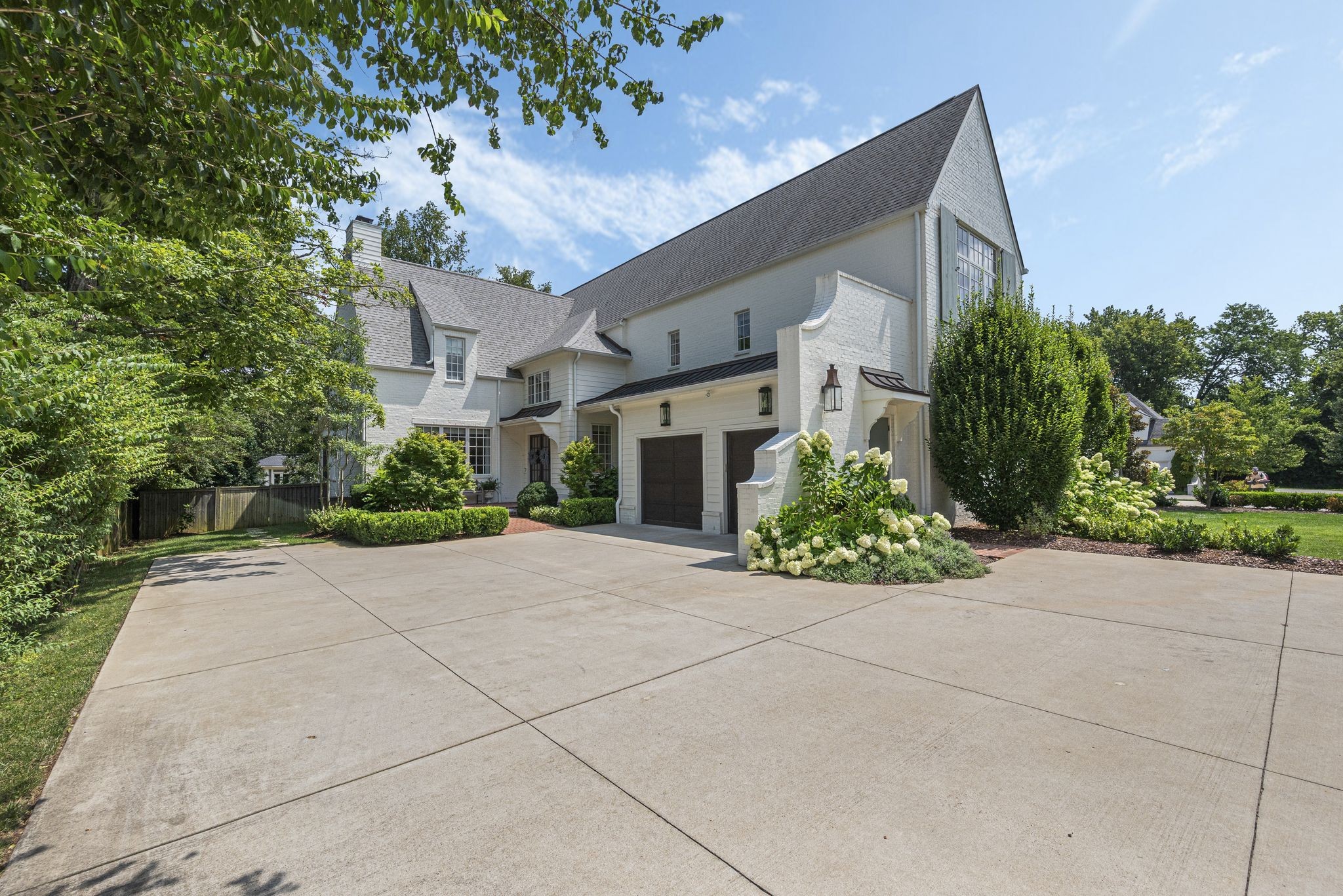 154 A Cheek Road Nashville, TN 37205 - Photo 60 of 61 a front view of a house with a yard and a garage