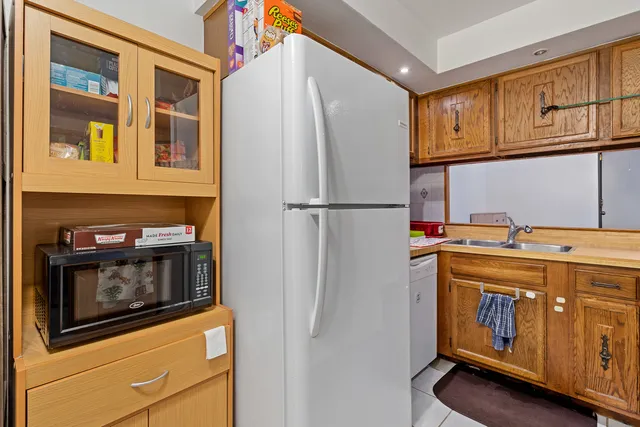 a kitchen with a stove and white cabinets