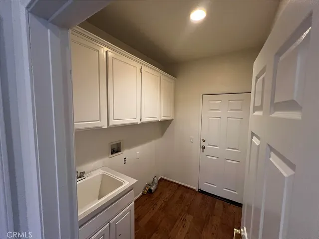 a kitchen with cabinets and window