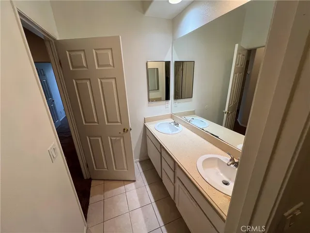 a bathroom with a sink a mirror and a shower