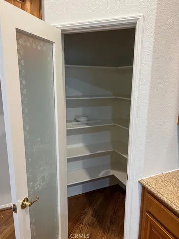 a storage room with wooden floor