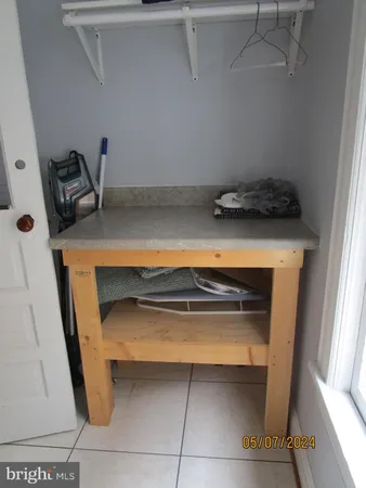 a stove top oven sitting inside of a kitchen