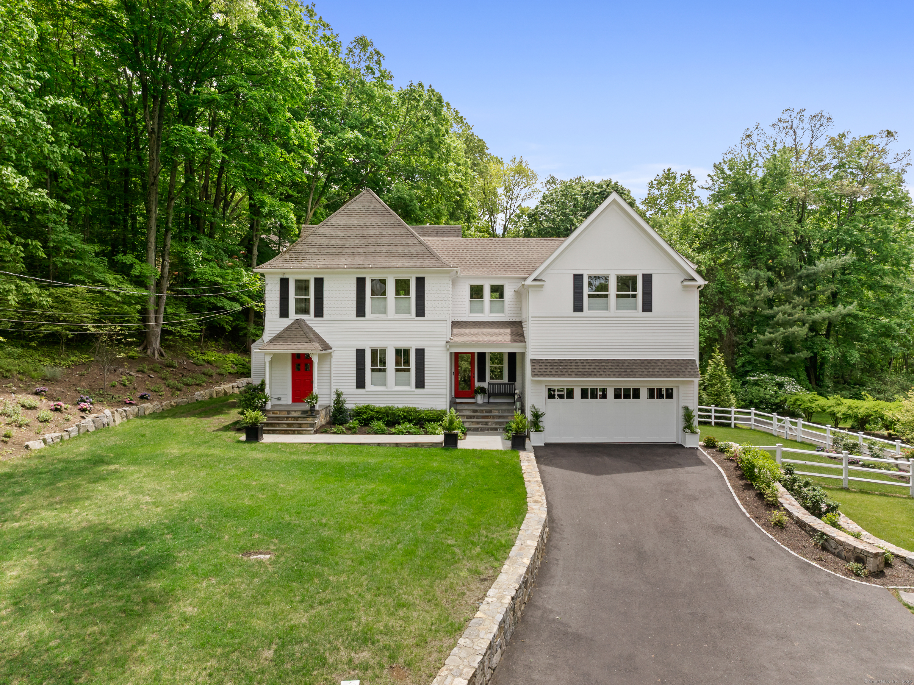 79 Devils Garden Road Norwalk, CT 06854 - Photo 1 of 1 a house with green field in front of it