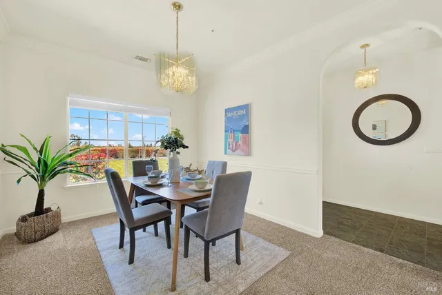 a kitchen with a sink stainless steel appliances and counter space