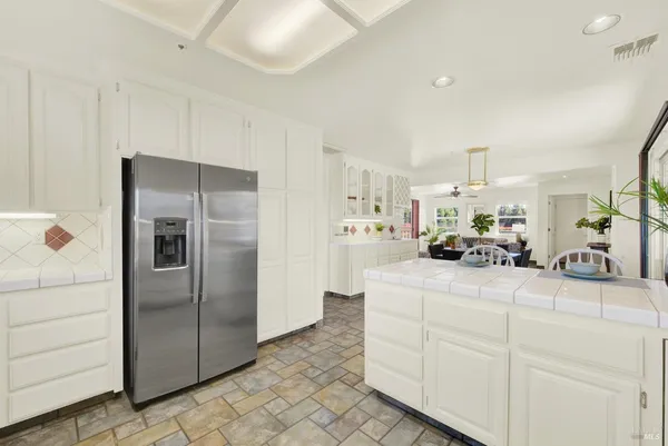 a bathroom with a sink a mirror and a shower