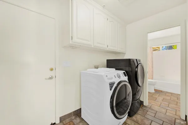 a spacious bedroom with a bed and a couch