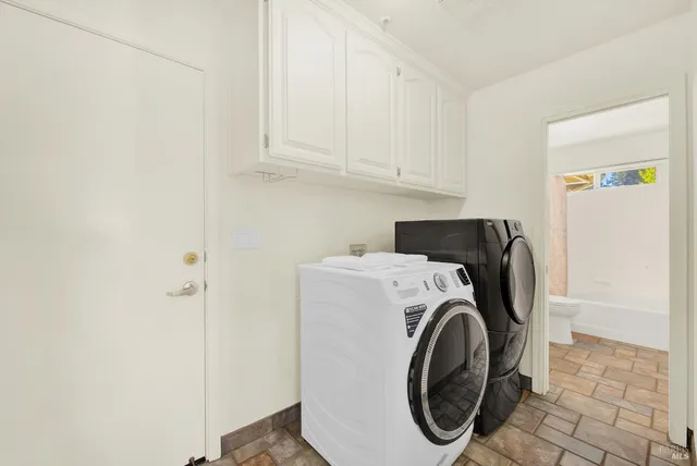 a spacious bedroom with a bed and a couch