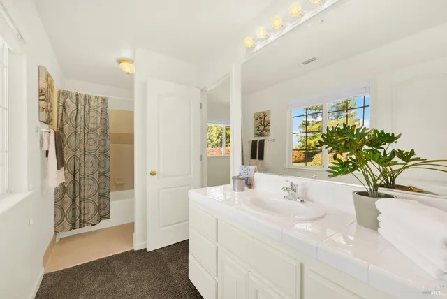 a view of a house with a backyard porch and sitting area