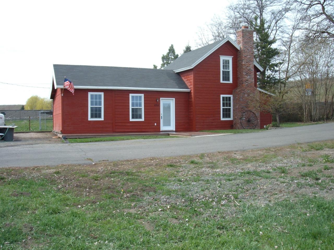 10502 Ahtanum Road Yakima, WA 98903 - Photo 1 of 7 a brick house with a yard