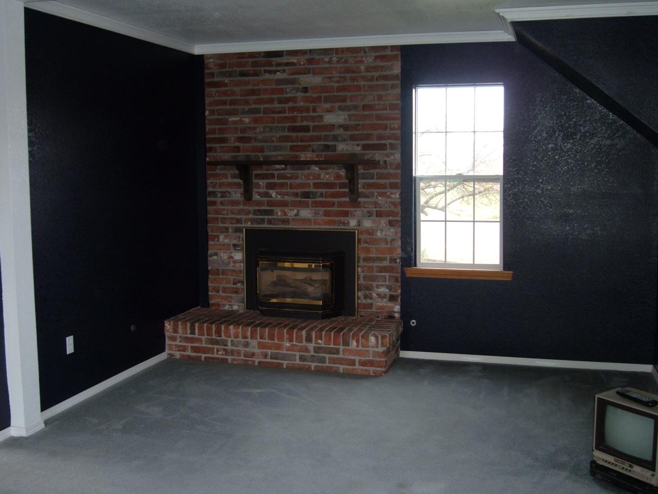 10502 Ahtanum Road Yakima, WA 98903 - Photo 4 of 7 a living room with furniture window and a fireplace