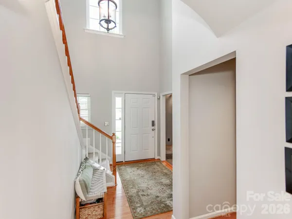 a view of entryway with wooden floor
