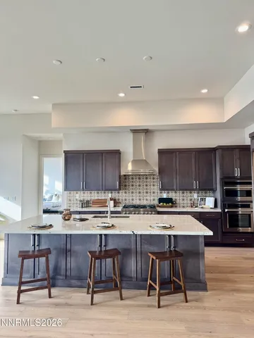 a bedroom with bed and a large window
